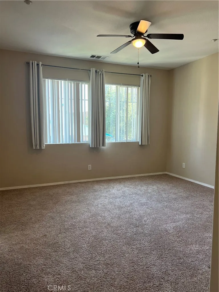 7161 East Avenue, Unit 104 Rancho Cucamonga, CA 91730 - Photo 12 of 18 a view of an empty room with a window