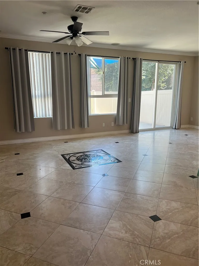 7161 East Avenue, Unit 104 Rancho Cucamonga, CA 91730 - Photo 3 of 18 an empty room with windows