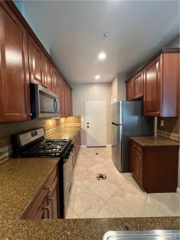 a kitchen with a sink and a window
