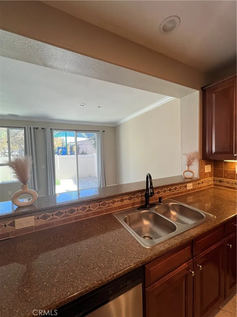 7161 East Avenue, Unit 104 Rancho Cucamonga, CA 91730 - Photo 6 of 18 a kitchen with a sink and a window