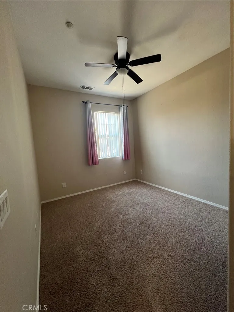 7161 East Avenue, Unit 104 Rancho Cucamonga, CA 91730 - Photo 9 of 18 an empty room that has a window in it