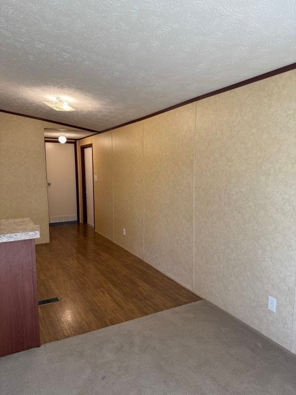 538 Cottle Town Road Smithville, TX 78957 - Photo 11 of 38 an empty room with wooden floor and entrance