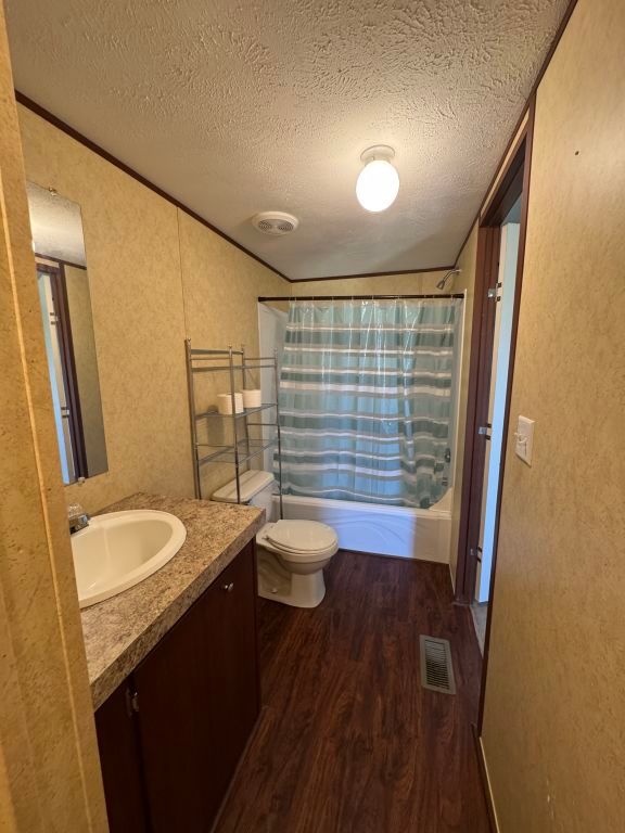 538 Cottle Town Road Smithville, TX 78957 - Photo 15 of 38 a bathroom with a granite countertop sink toilet and shower