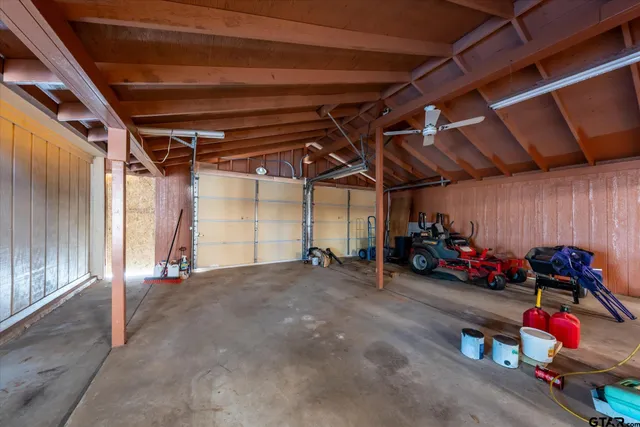 a view of a swimming pool with a couches in a patio