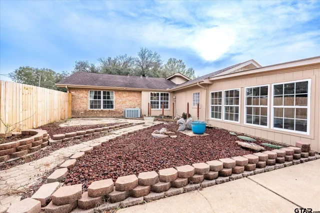 swimming pool view with two chairs