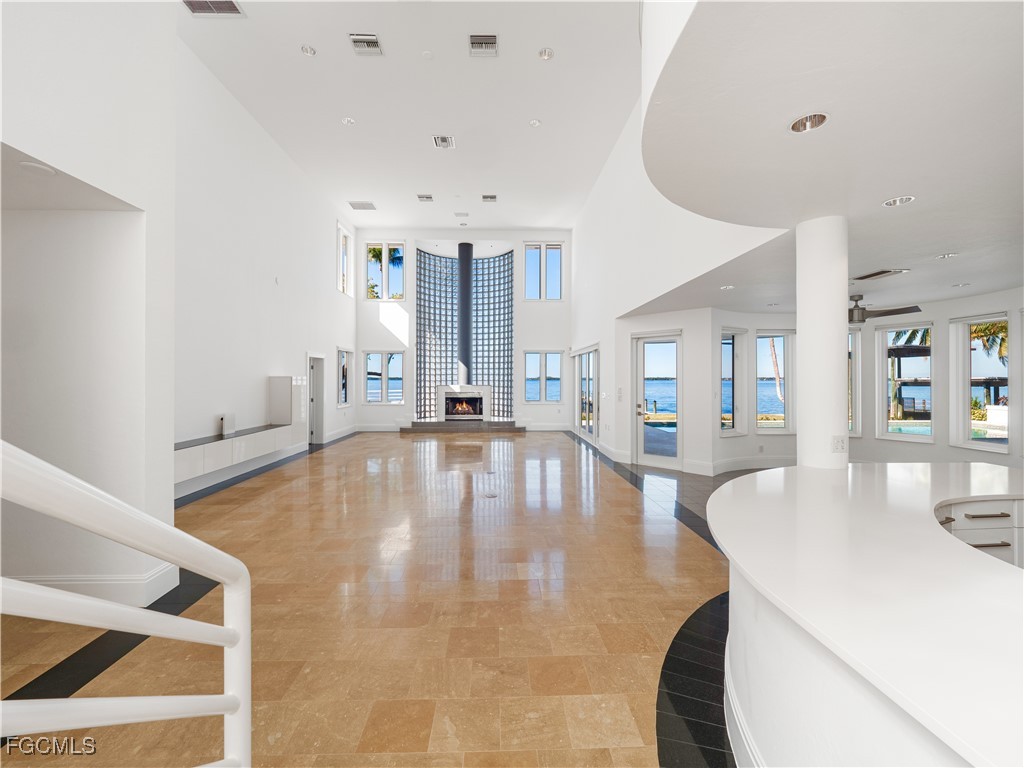 3402 West Riverside Drive Fort Myers, FL 33901 - Photo 11 of 50 a large white kitchen with wooden floor