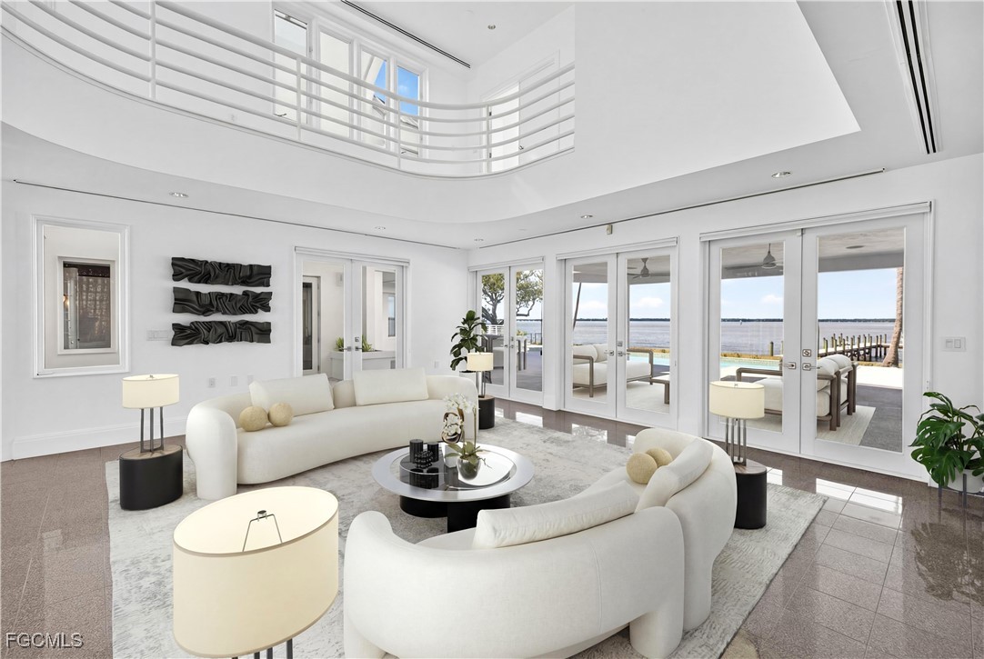 3402 West Riverside Drive Fort Myers, FL 33901 - Photo 20 of 50 a living room with furniture and a large window