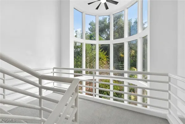 a room with a cabinets and chandelier