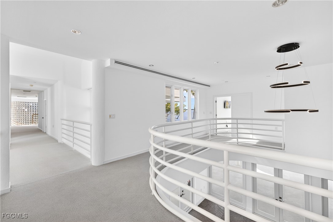 3402 West Riverside Drive Fort Myers, FL 33901 - Photo 22 of 50 a room with a cabinets and chandelier