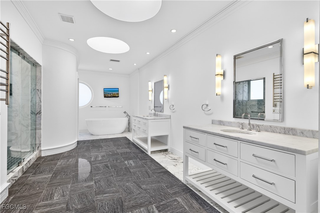 3402 West Riverside Drive Fort Myers, FL 33901 - Photo 24 of 50 a bathroom with a sink a toilet and a mirror