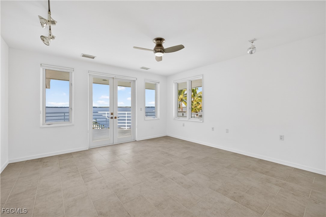 3402 West Riverside Drive Fort Myers, FL 33901 - Photo 28 of 50 a view of an empty room with a window