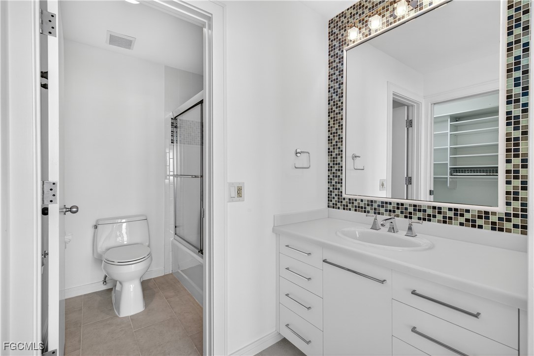 3402 West Riverside Drive Fort Myers, FL 33901 - Photo 30 of 50 a bathroom with a sink toilet and shower