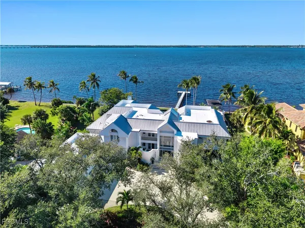 an aerial view of a house with an outdoor space