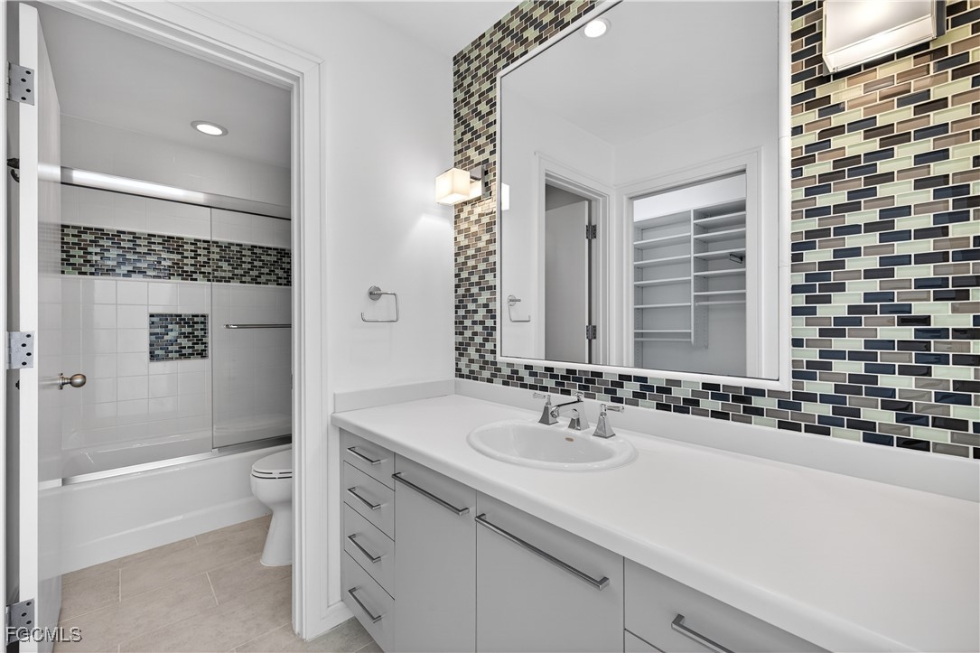 3402 West Riverside Drive Fort Myers, FL 33901 - Photo 33 of 50 a bathroom with a sink a toilet and shower