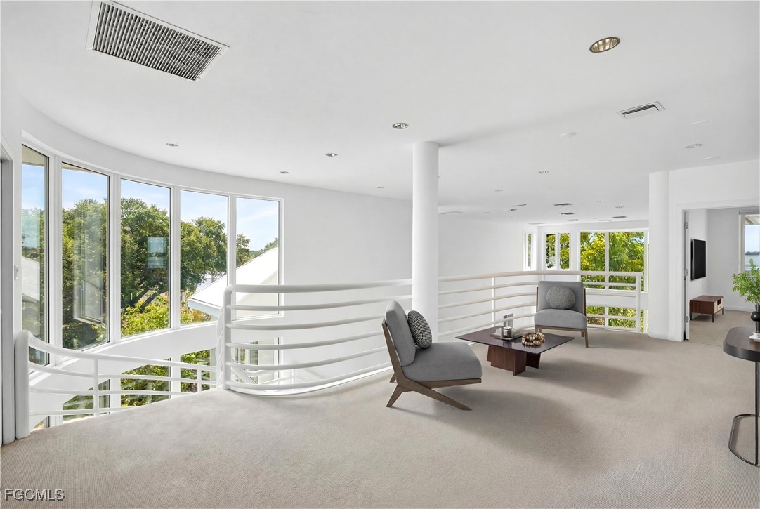 3402 West Riverside Drive Fort Myers, FL 33901 - Photo 39 of 50 a living room with furniture and large windows