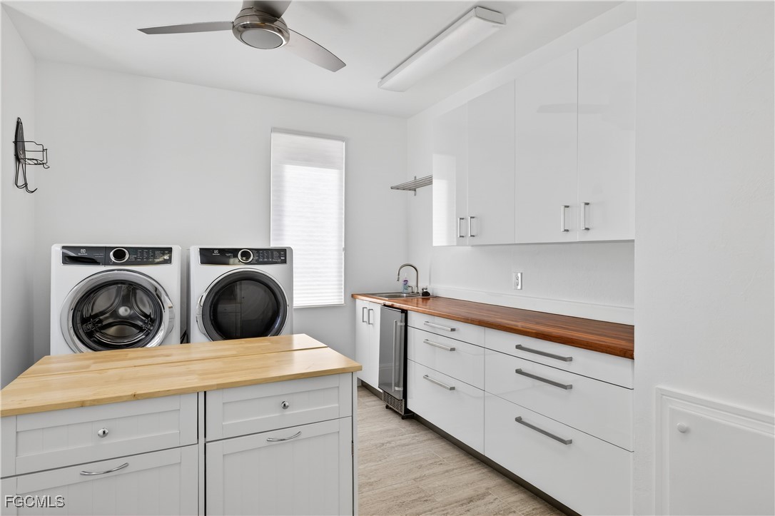 3402 West Riverside Drive Fort Myers, FL 33901 - Photo 41 of 50 a utility room with sink dryer and washer