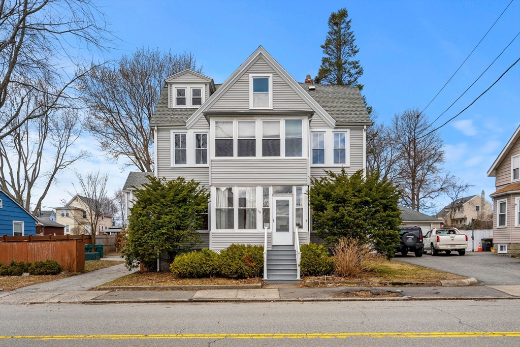 76 Myrtle Street Lynn, MA 01905 - Photo 2 of 27 a front view of a house with a yard