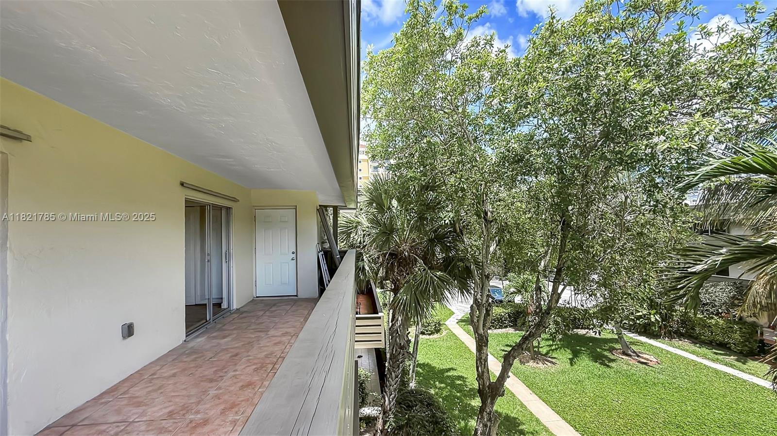 8335 Southwest 72nd Avenue, Unit 315D Miami, FL 33143 - Photo 12 of 28 wooden floor in a backyard of a house