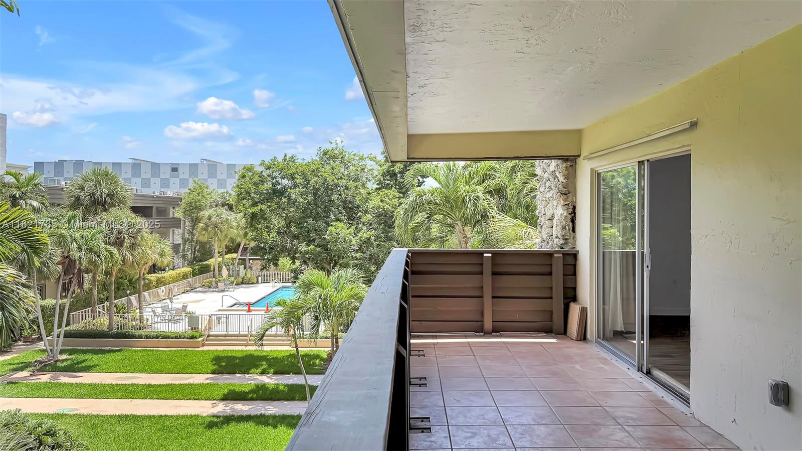 8335 Southwest 72nd Avenue, Unit 315D Miami, FL 33143 - Photo 13 of 28 a view of front door and porch
