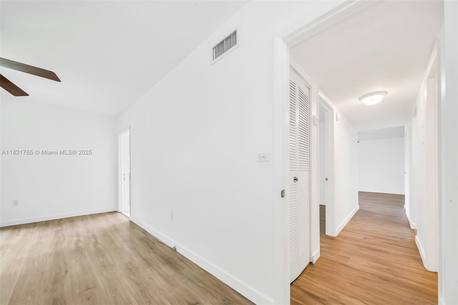 8335 Southwest 72nd Avenue, Unit 315D Miami, FL 33143 - Photo 19 of 28 a view of a hallway with wooden floor