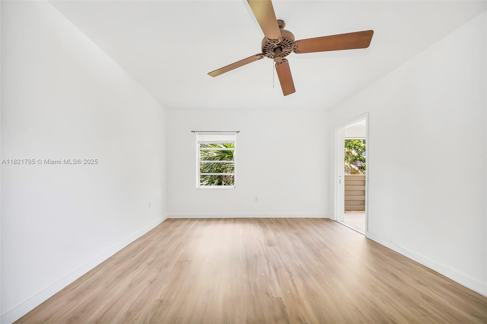 8335 Southwest 72nd Avenue, Unit 315D Miami, FL 33143 - Photo 21 of 28 a view of room with hardwood floor and window