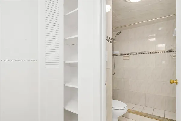 a bathroom with a shower and a toilet