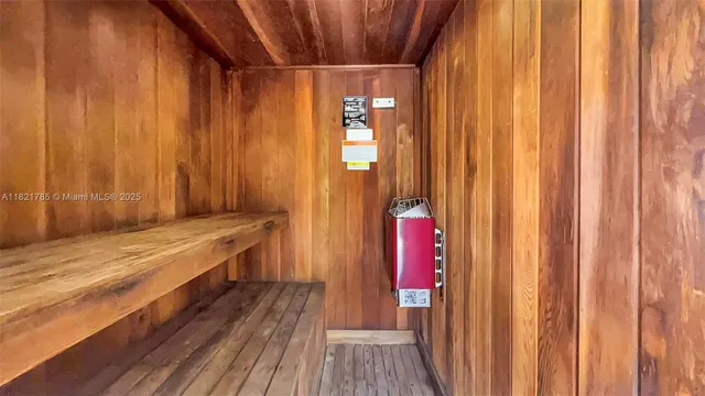 a view of a bathroom with a sink and wooden floor