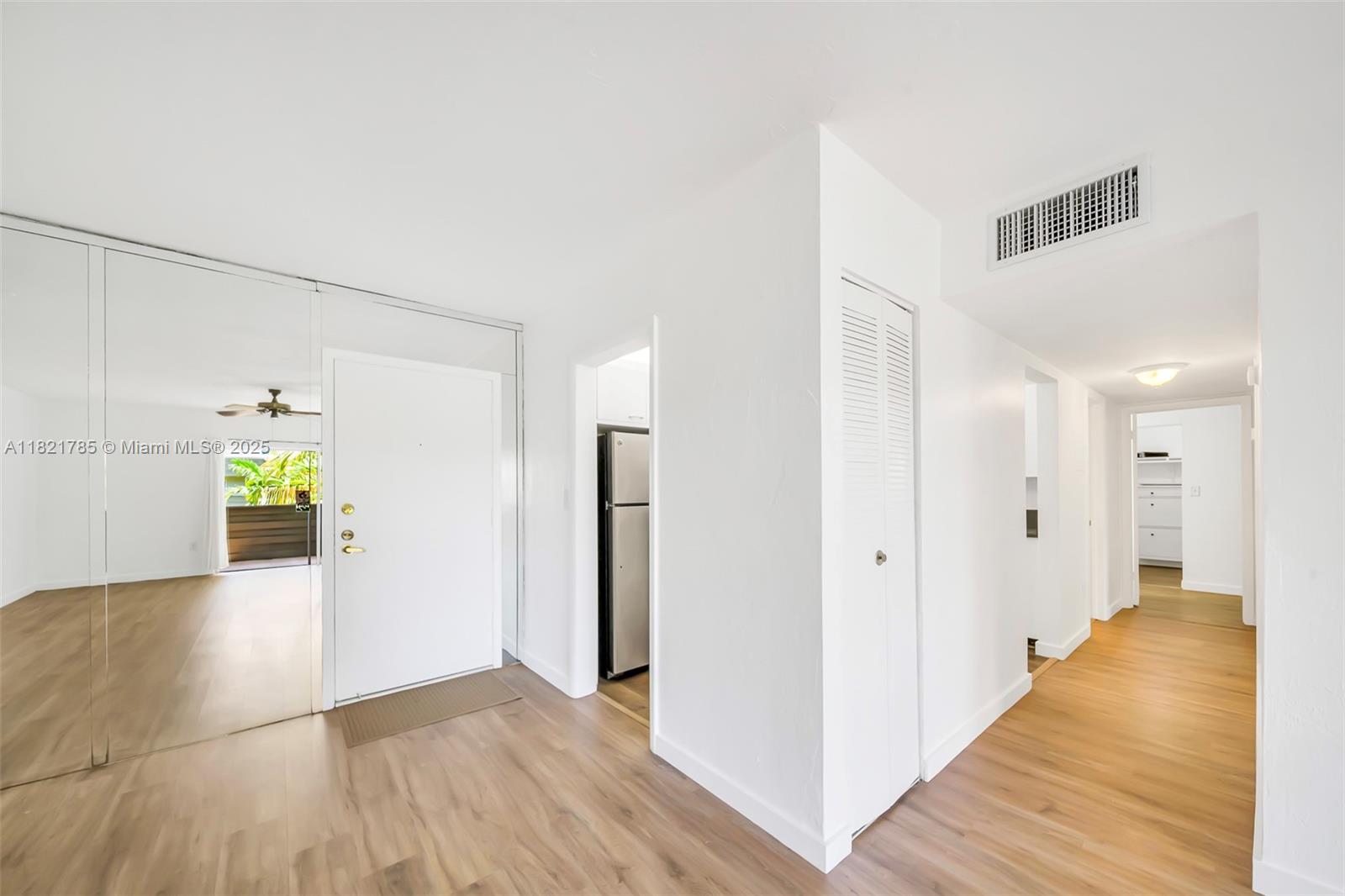 8335 Southwest 72nd Avenue, Unit 315D Miami, FL 33143 - Photo 6 of 28 a view of a hallway with wooden floor and staircase