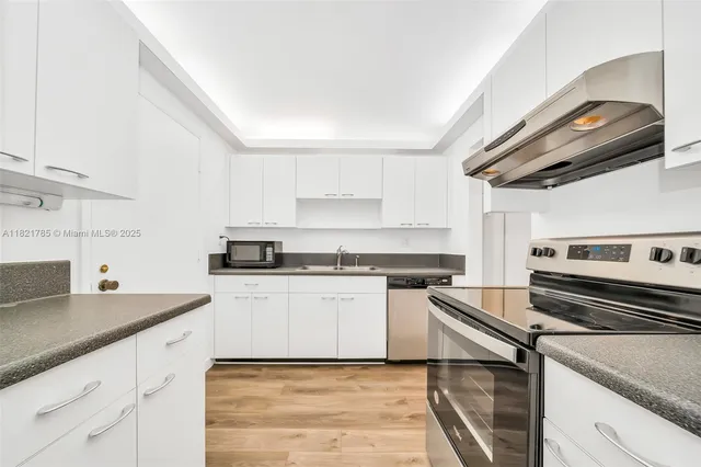 a kitchen with a stove and a sink