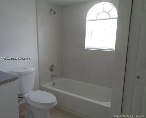 a bathroom with a sink toilet and bathtub