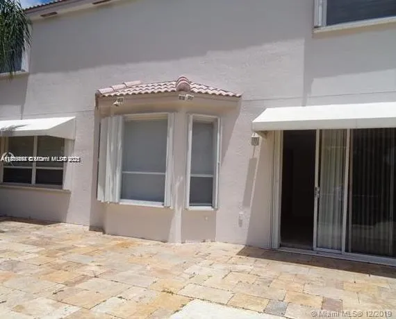 a view of a swimming pool with a yard