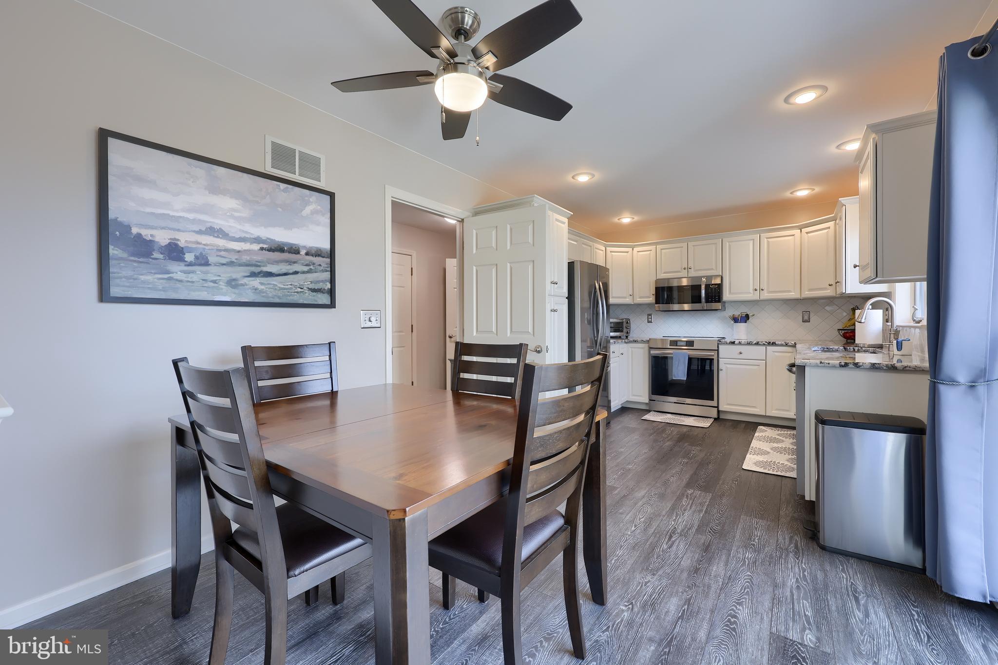 35 Field Lane Lititz, PA 17543 - Photo 14 of 49 a view of a dining room with furniture and wooden floor