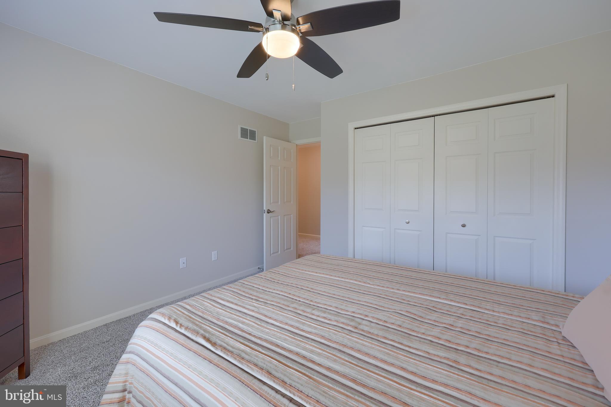 35 Field Lane Lititz, PA 17543 - Photo 28 of 49 a bedroom with a bed and a chandelier