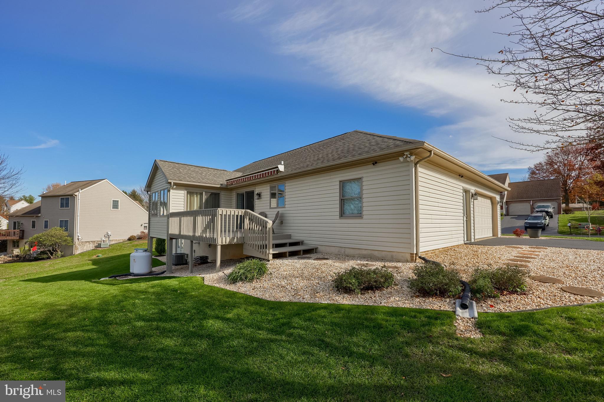 35 Field Lane Lititz, PA 17543 - Photo 43 of 49 a backyard of a house with table and chairs