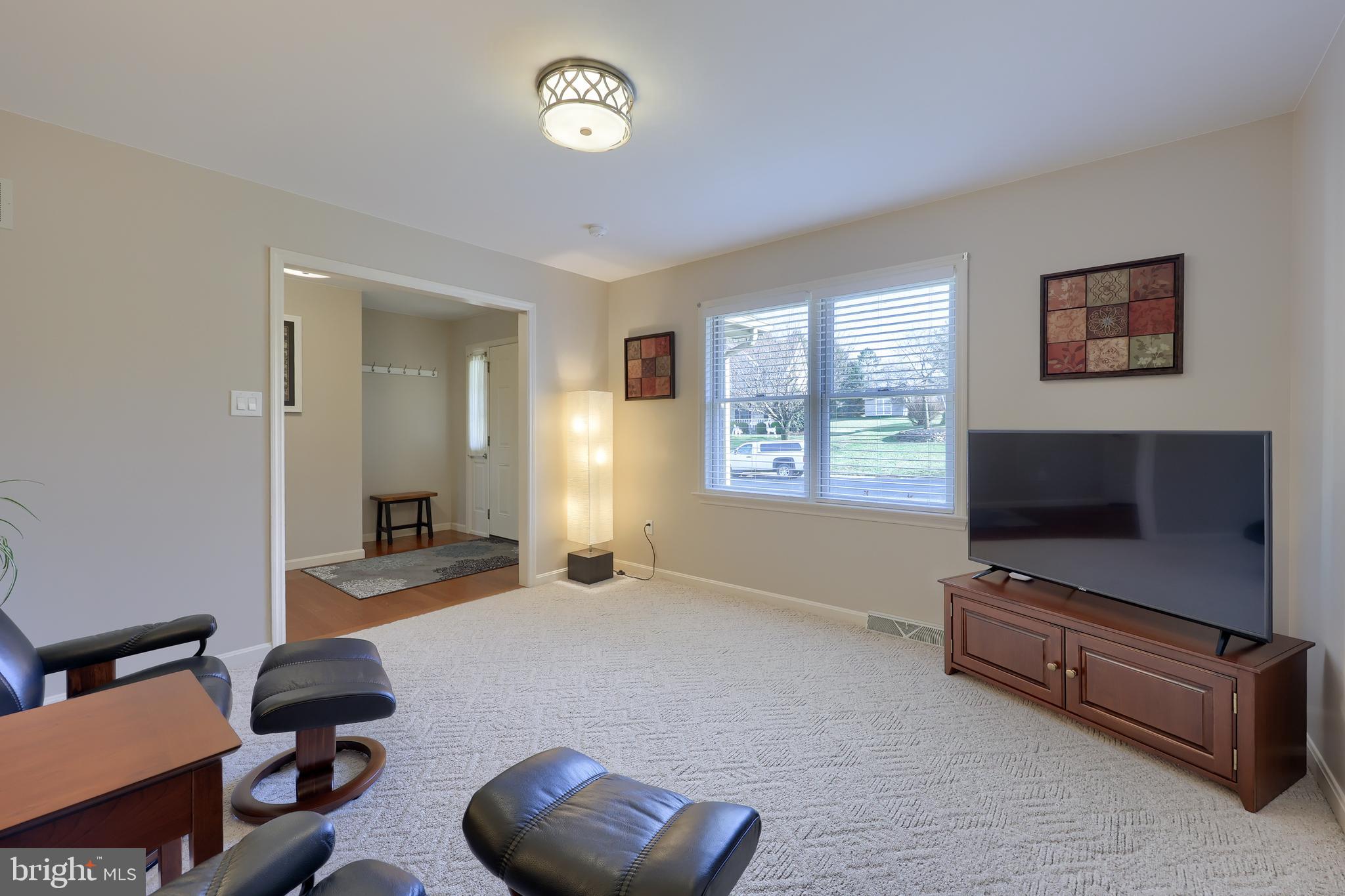 35 Field Lane Lititz, PA 17543 - Photo 6 of 49 a living room with furniture and a flat screen tv