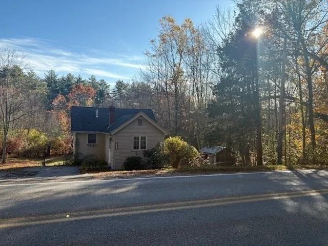 a view of a house with a street