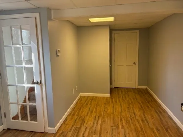 a view of front door with wooden floor