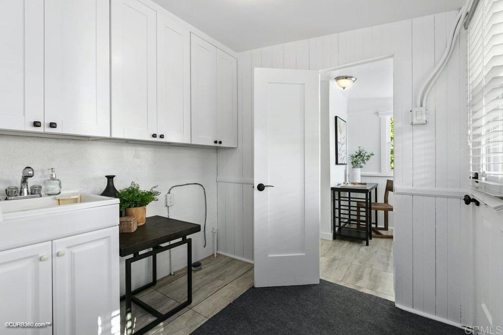 1453-1455 Thomas Avenue San Diego, CA 92109 - Photo 15 of 37 a view of kitchen with furniture and wooden floor