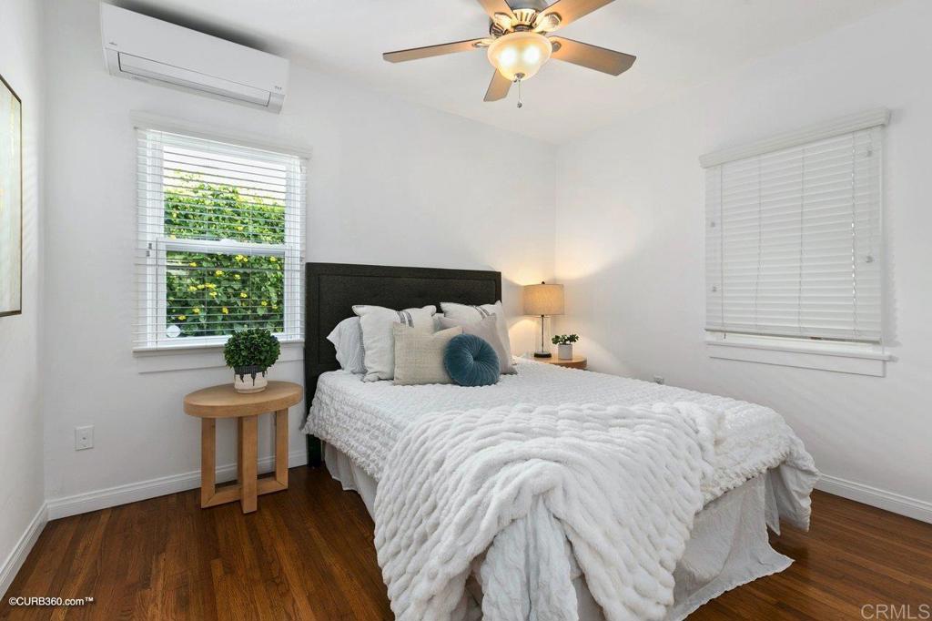 1453-1455 Thomas Avenue San Diego, CA 92109 - Photo 19 of 37 a bedroom with a bed and a window
