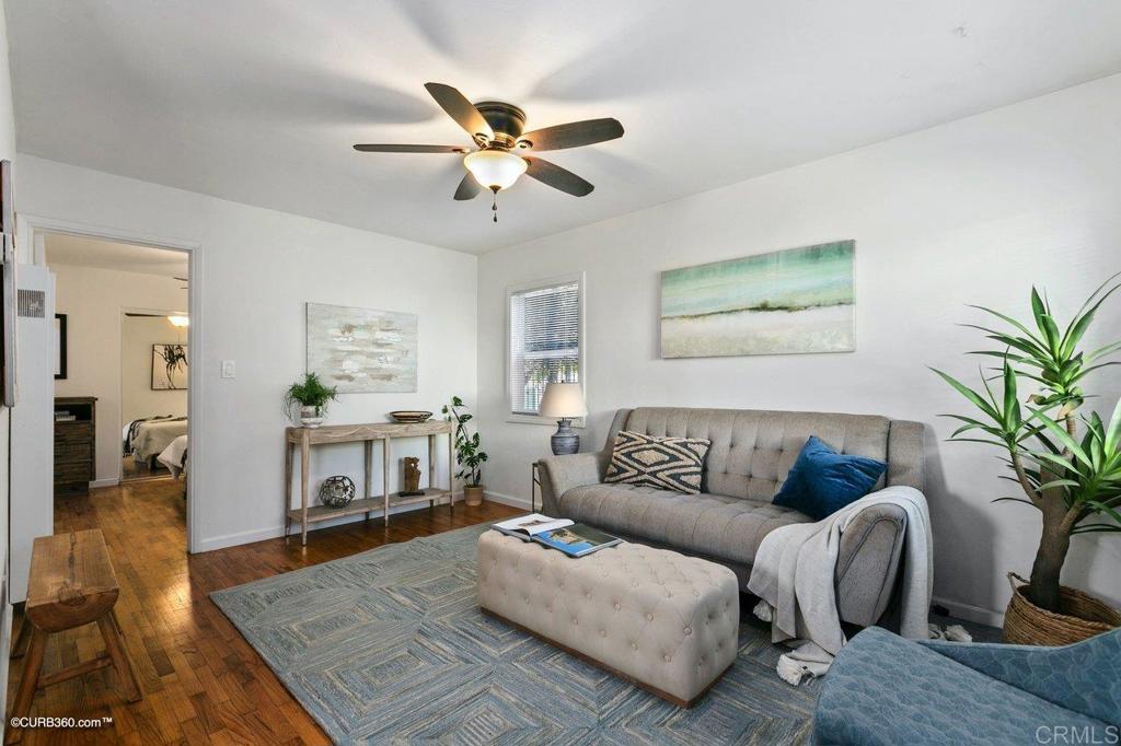 1453-1455 Thomas Avenue San Diego, CA 92109 - Photo 28 of 37 a living room with furniture and a dining table
