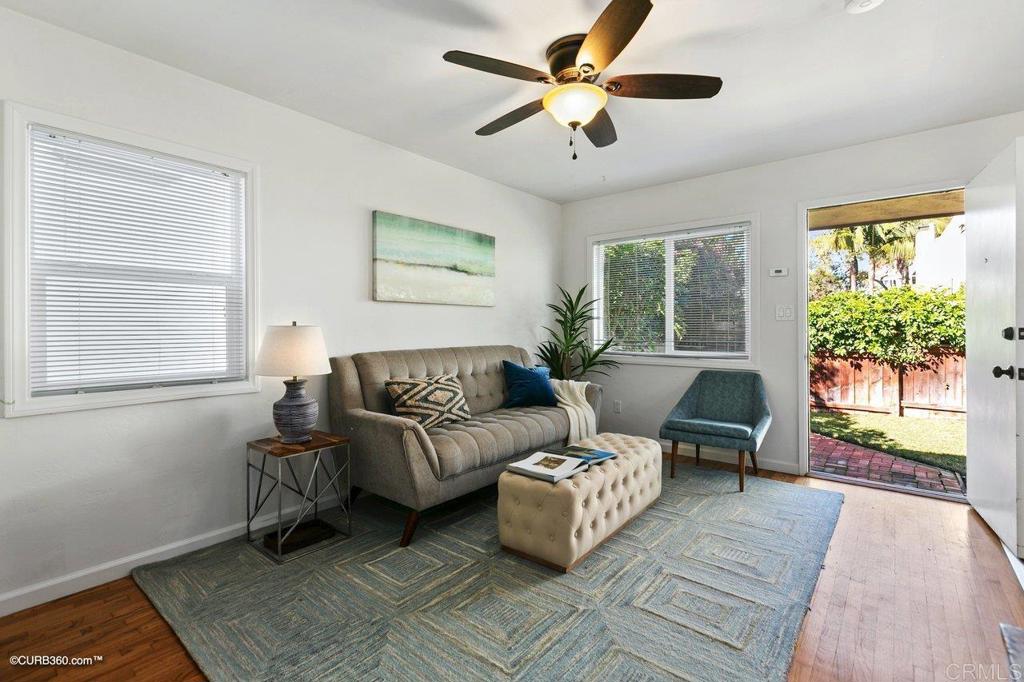 1453-1455 Thomas Avenue San Diego, CA 92109 - Photo 29 of 37 a living room with furniture and a large window