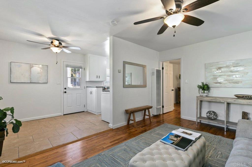 1453-1455 Thomas Avenue San Diego, CA 92109 - Photo 30 of 37 a living room with furniture and a wooden floor