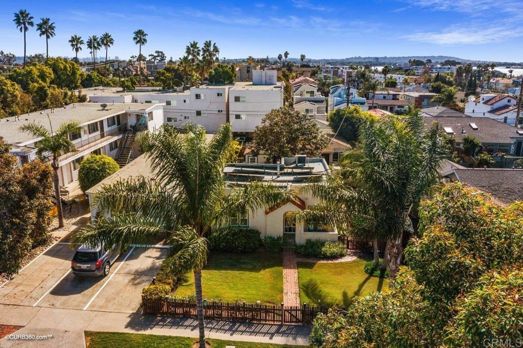 1453-1455 Thomas Avenue San Diego, CA 92109 - Photo 37 of 37 an aerial view of residential houses with outdoor space and swimming pool