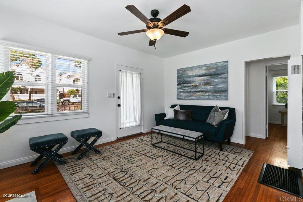 1453-1455 Thomas Avenue San Diego, CA 92109 - Photo 9 of 37 a living room with furniture a window and a rug