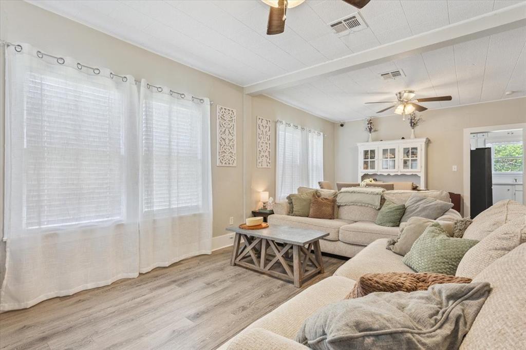 102 Brookshire Street Riesel, TX 76682 - Photo 7 of 24 a living room with furniture and a chandelier