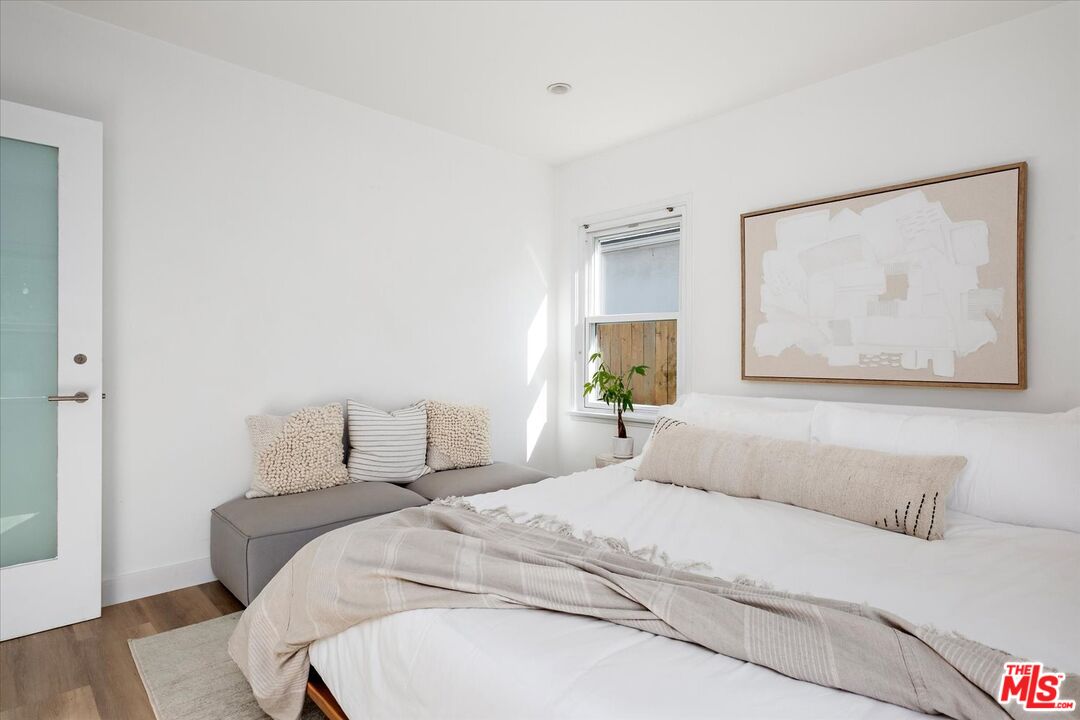 10944 Stever Street Culver City, CA 90230 - Photo 14 of 25 a bedroom with a bed and painting on the wall