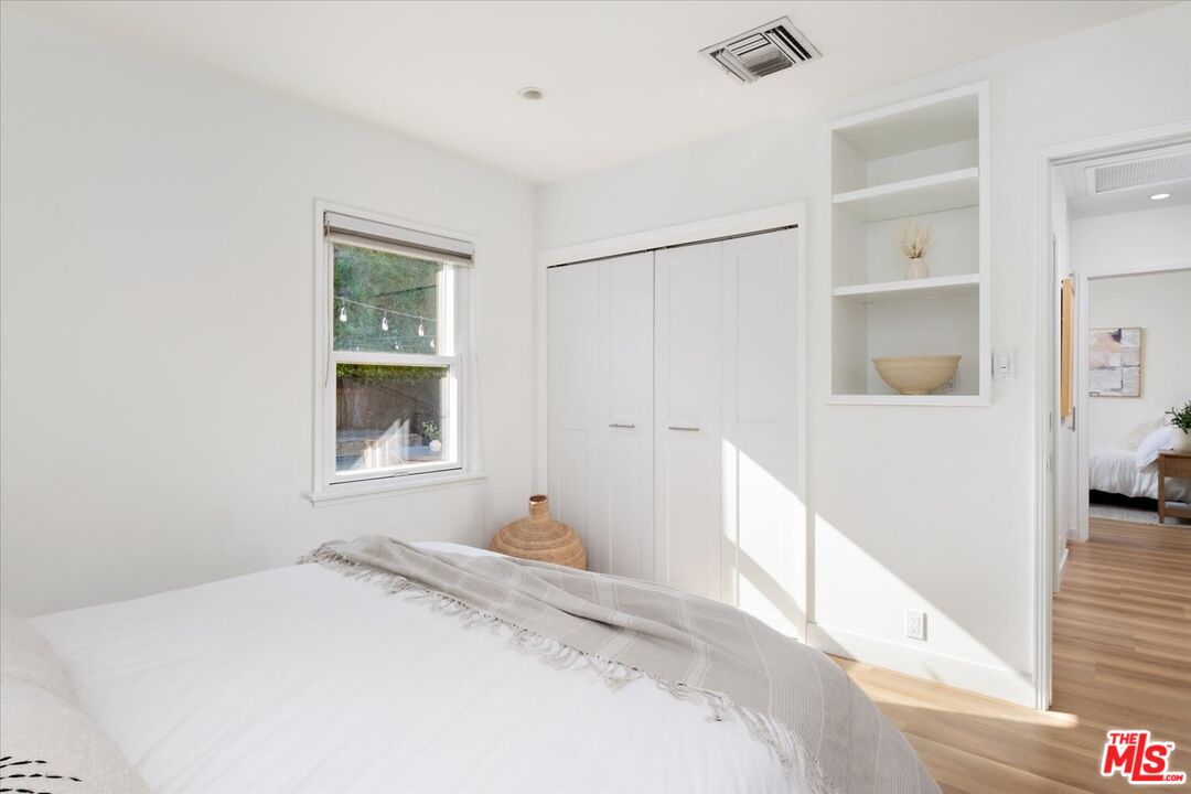 10944 Stever Street Culver City, CA 90230 - Photo 15 of 25 a bedroom with a bed and a window