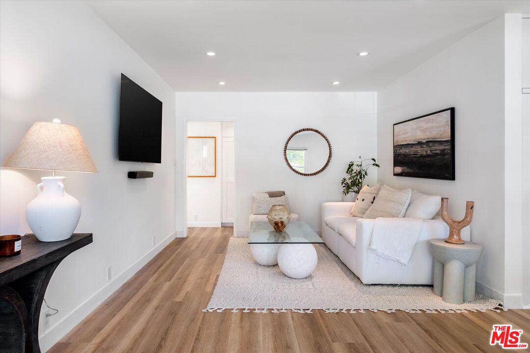 10944 Stever Street Culver City, CA 90230 - Photo 4 of 25 a bedroom with furniture and a flat screen tv