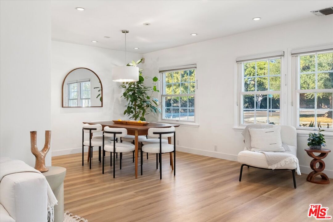 10944 Stever Street Culver City, CA 90230 - Photo 6 of 25 a dining room with furniture a window and a chandelier