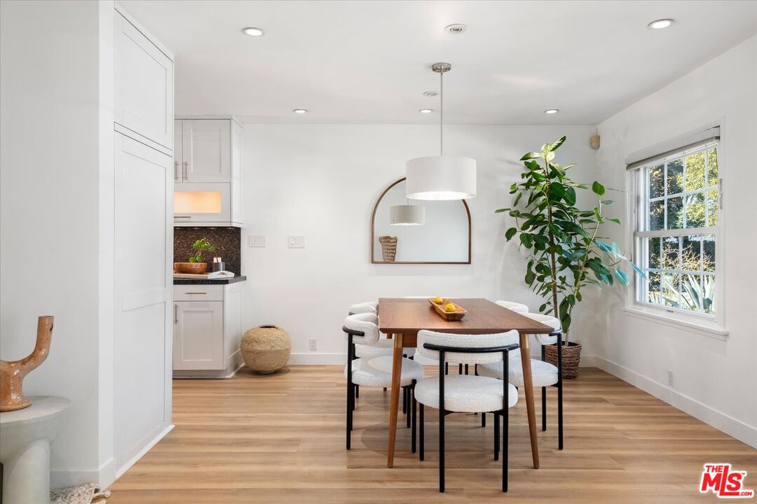 10944 Stever Street Culver City, CA 90230 - Photo 7 of 25 a view of a dining room with furniture and wooden floor